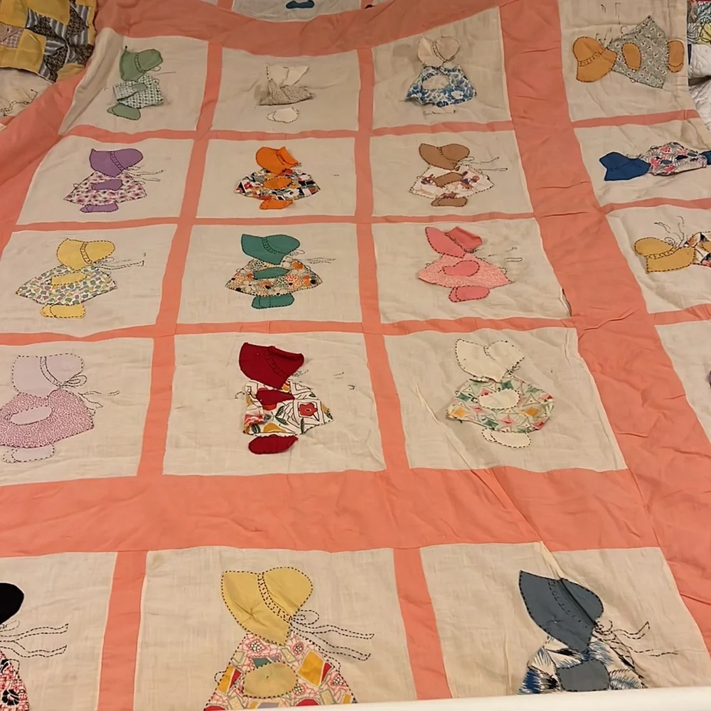 64”  x 74” double sided pinwheel and Sunbonnet sue heavy hand sewn quilt